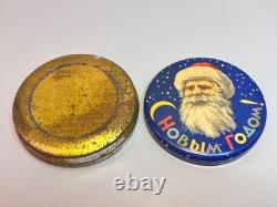Boîte en fer-blanc de bonbons soviétiques russes de 1960 avec le visage du Père Noël et confettis